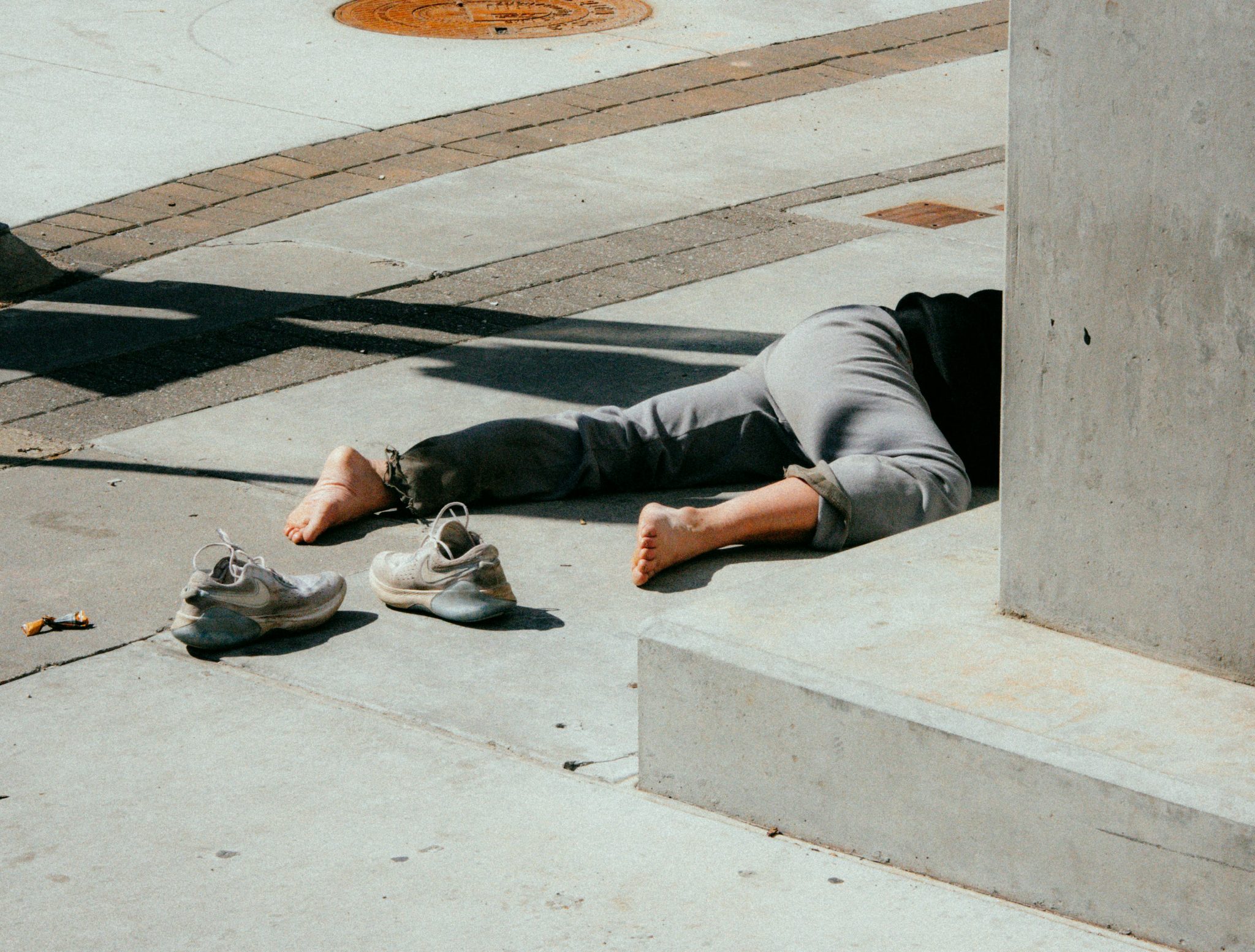 Photo of the legs of a person that was in an accident in the street